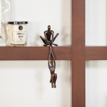 Ofrus Bronze Man Lifting Woman from Ledge Sculpture